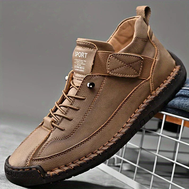 Women's high-top lace-up trainers with stitched panels and flat soles