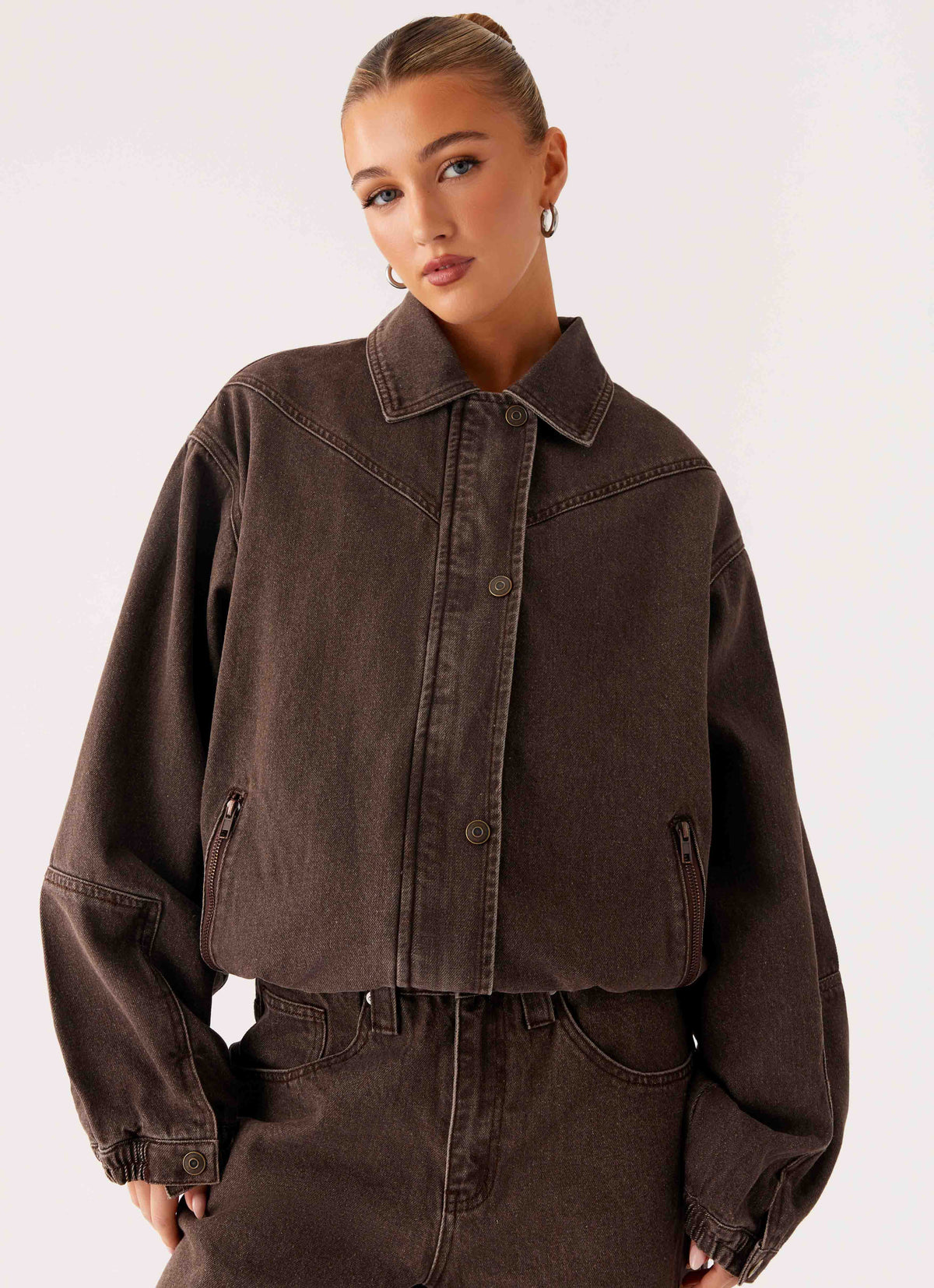 Women's brown washed denim bomber jacket with collar and cropped fit