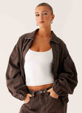 Women's brown washed denim bomber jacket with collar and cropped fit