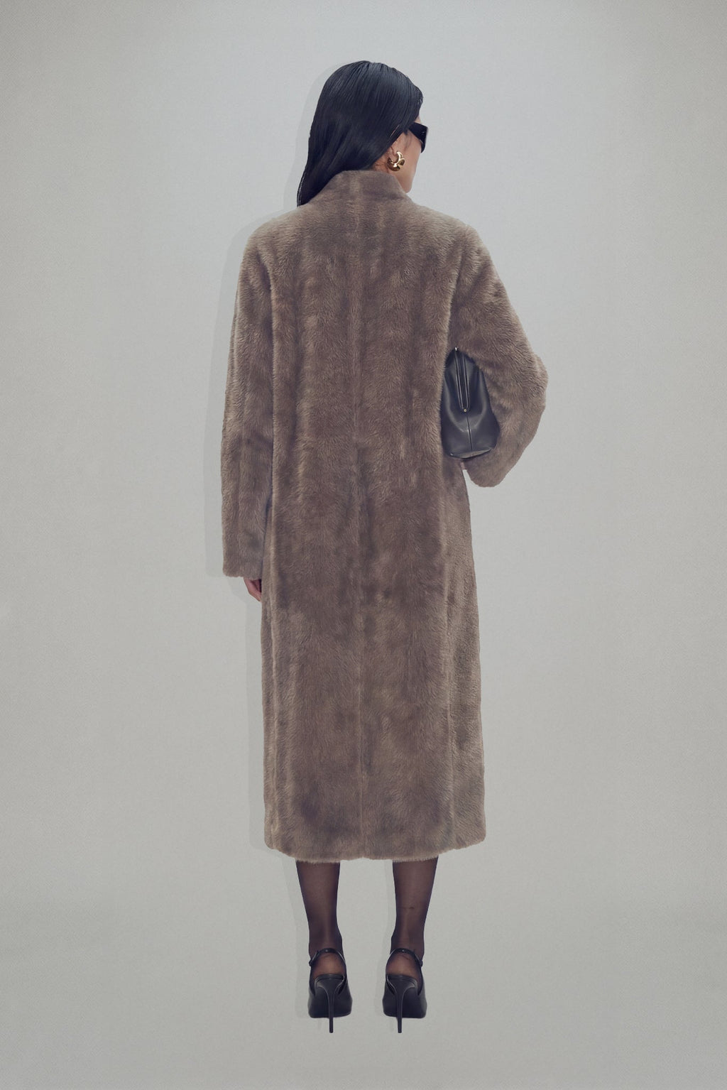 Women's brown longline coat with plush fur-effect texture and shawl collar