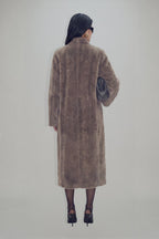 Women's brown longline coat with plush fur-effect texture and shawl collar