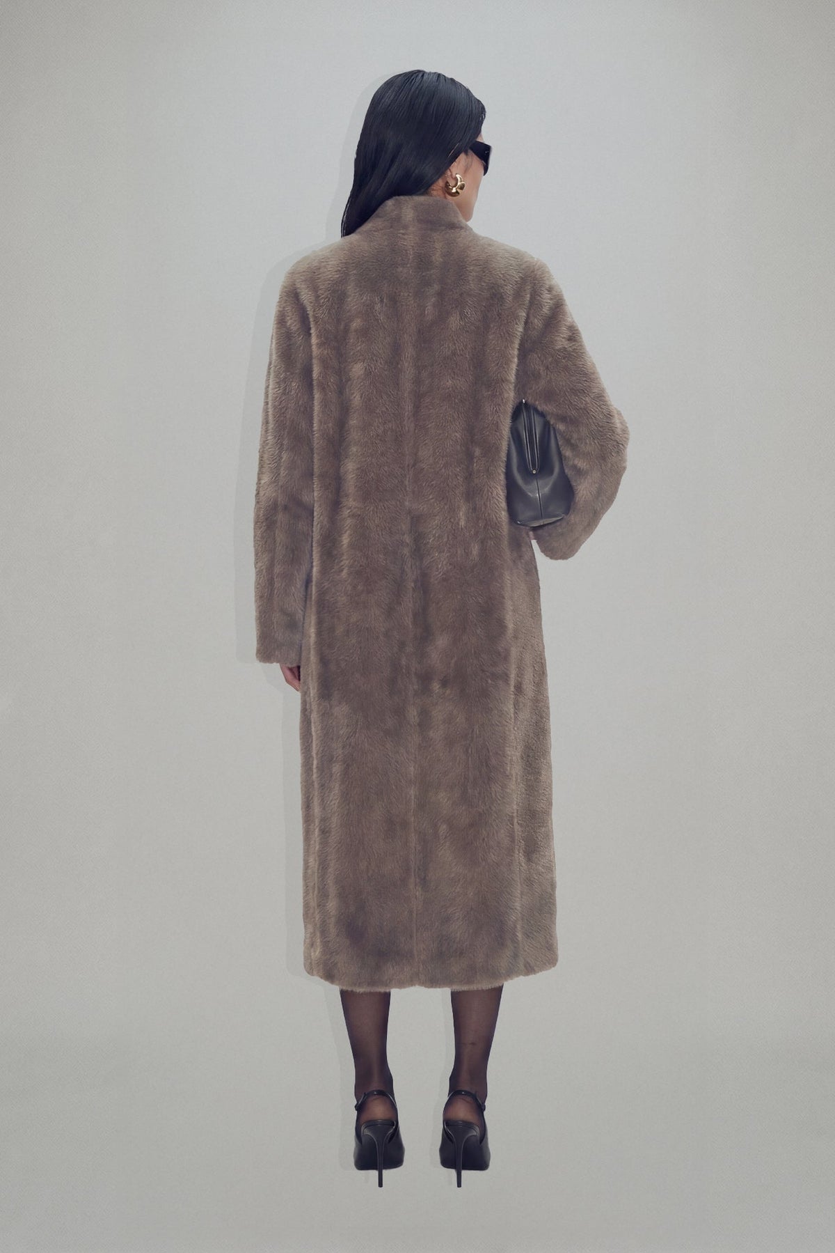 Women's brown longline coat with plush fur-effect texture and shawl collar