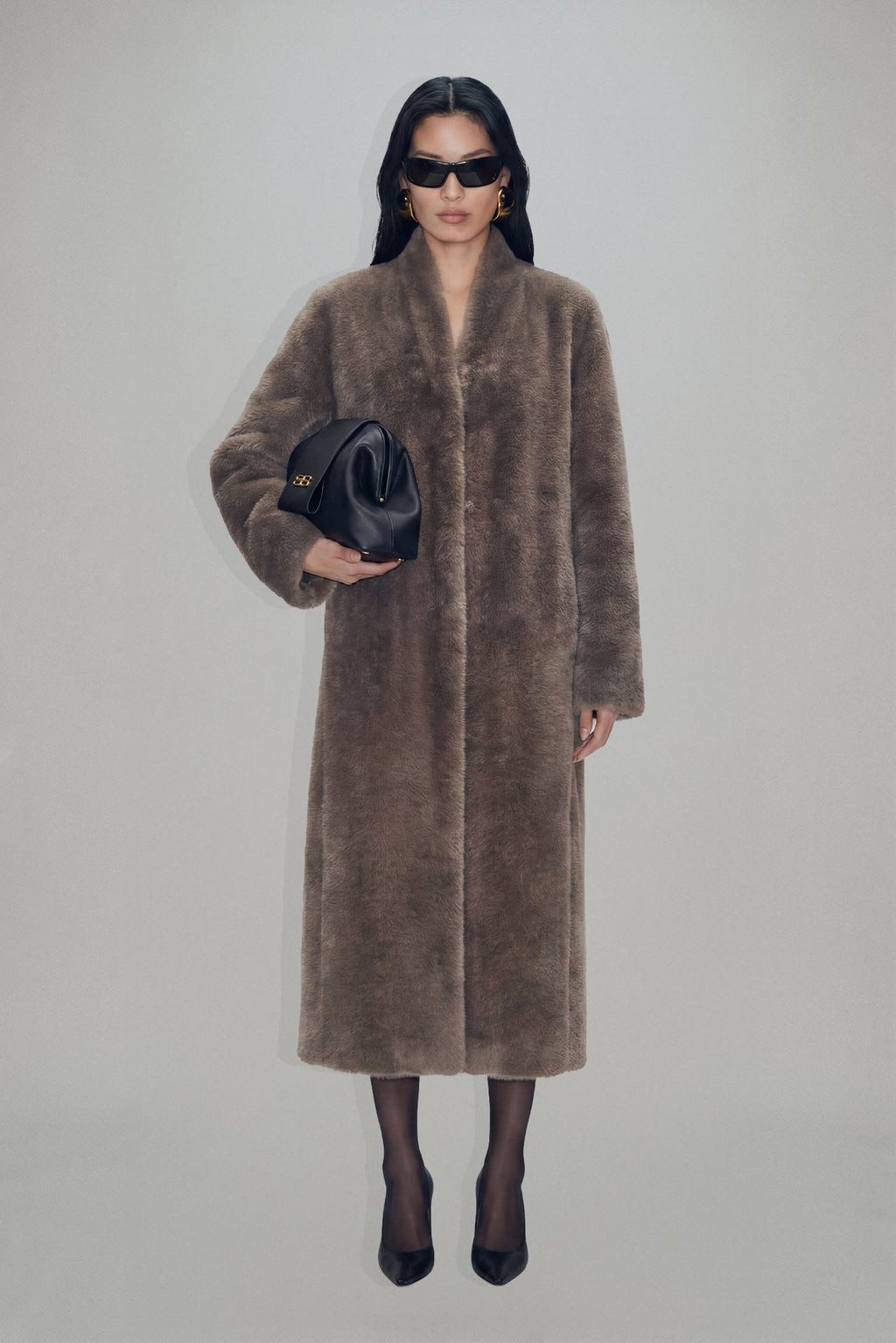 Women's brown longline coat with plush fur-effect texture and shawl collar