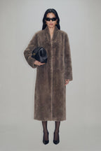 Women's brown longline coat with plush fur-effect texture and shawl collar