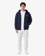 Men's navy full-zip hoodie with hood, front pockets and white chest monogram