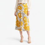 Women's cream floral A-line midi skirt with yellow flowers and dark leaf outlines