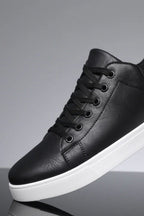 Men's low-top lace-up trainers with panelled uppers and contrasting flat soles