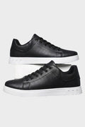 Men's low-top lace-up trainers with panelled uppers and contrasting flat soles