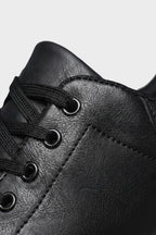 Men's low-top lace-up trainers with panelled uppers and contrasting flat soles