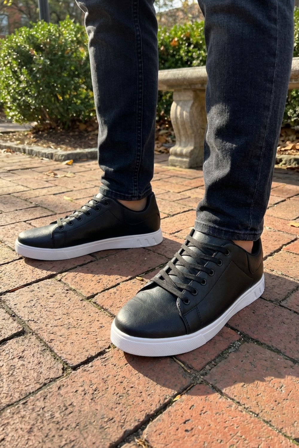 Men's low-top lace-up trainers with panelled uppers and contrasting flat soles