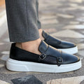 Men's double monk strap slip-on loafers shown in black and brown with white soles