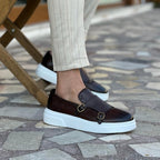 Men's double monk strap slip-on loafers shown in black and brown with white soles