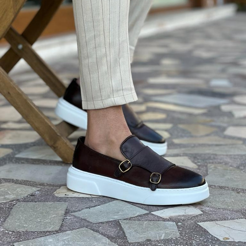 Men's double monk strap slip-on loafers shown in black and brown with white soles