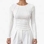 Women's fitted ribbed long sleeve top with round neck and curved front seams