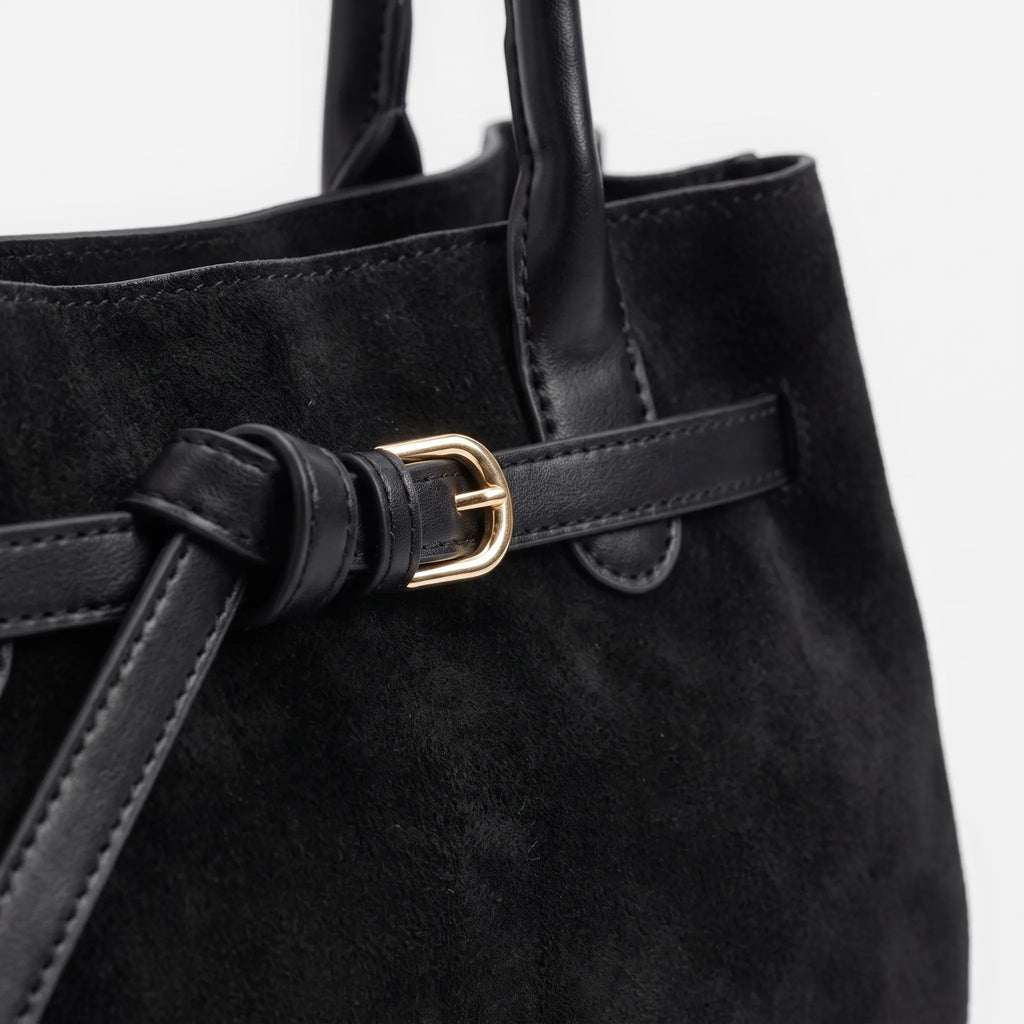 Structured women's tote bag with dual handles and front belt buckle detail