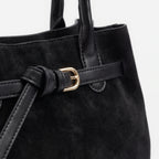 Structured women's tote bag with dual handles and front belt buckle detail