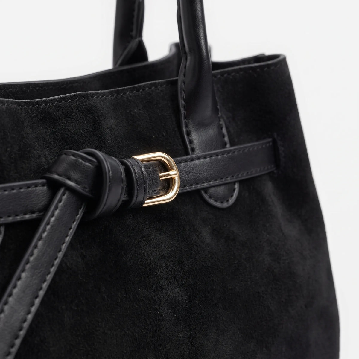 Structured women's tote bag with dual handles and front belt buckle detail