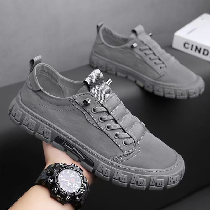Low-top lace-up sneakers with panelled uppers and thick textured soles