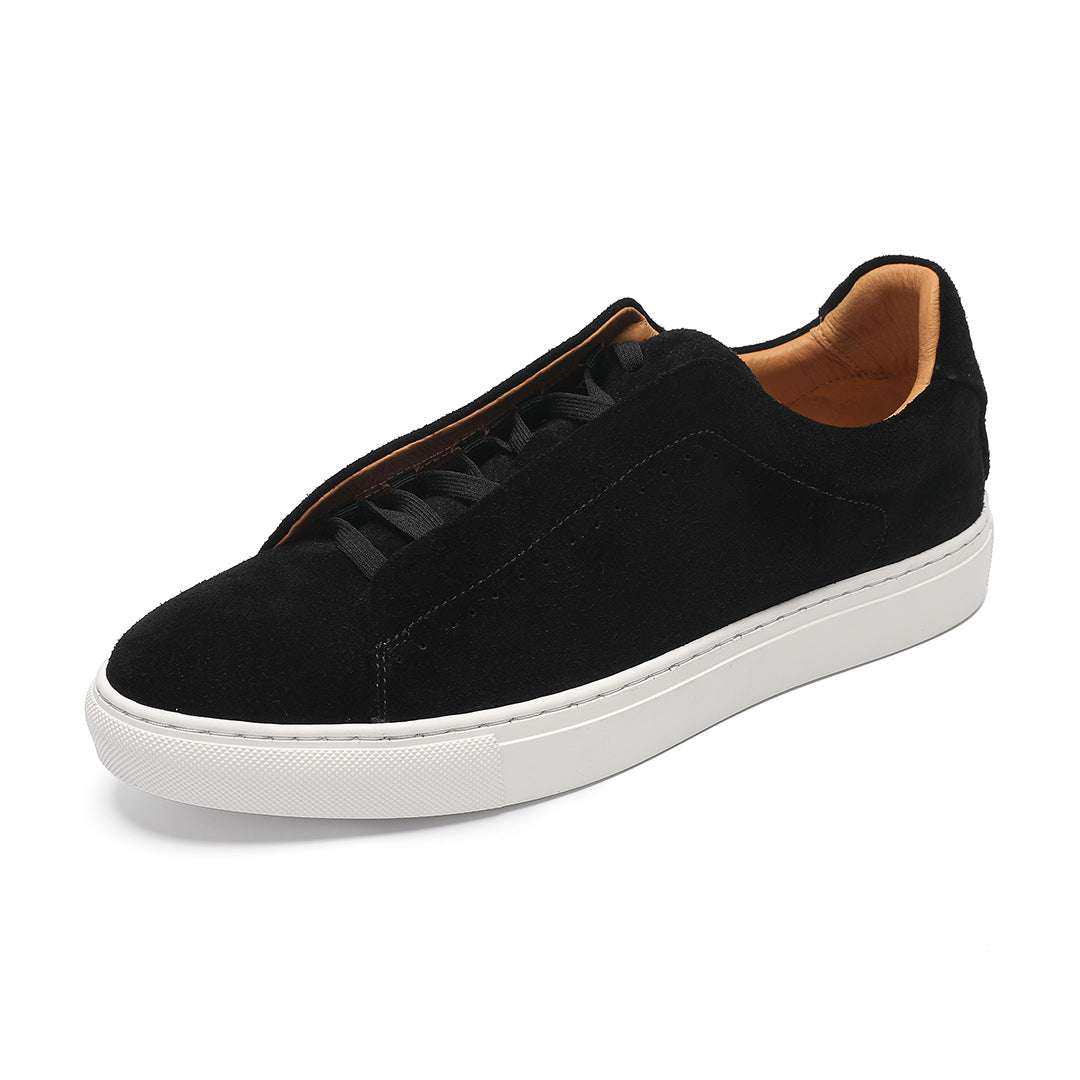 Low-top lace-up trainer with perforated side detailing and contrasting white sole
