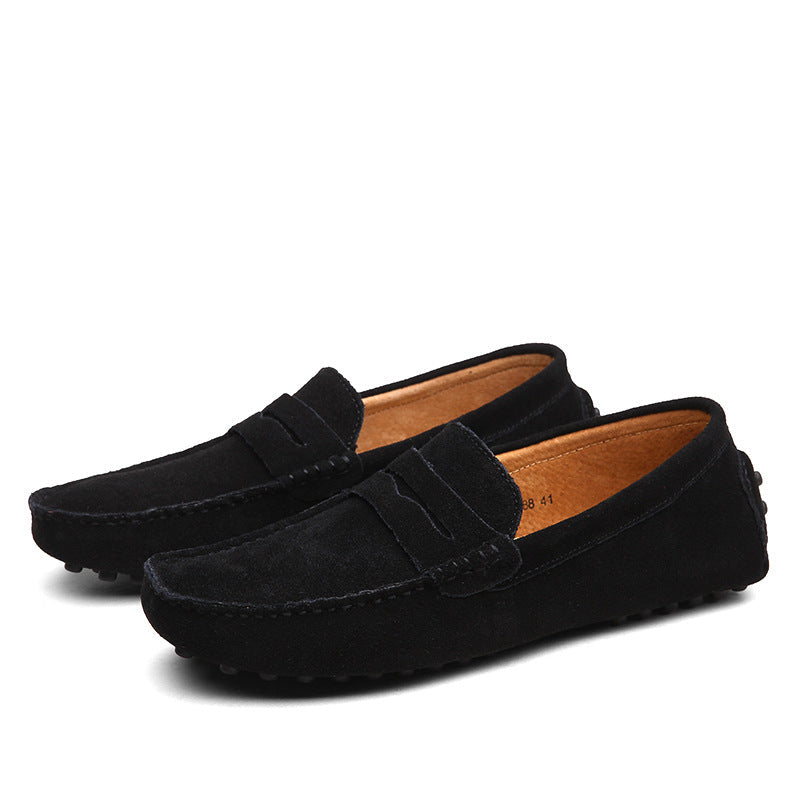Men's slip-on penny loafers with moc toe stitching and flat treaded soles