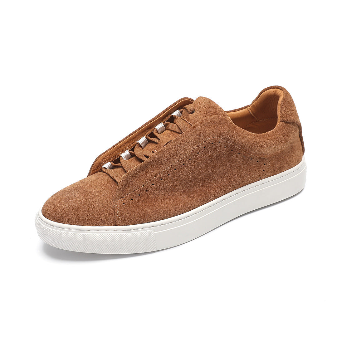 Low-top lace-up trainer with perforated side detailing and contrasting white sole