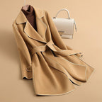 Women's longline belted trench coat with wide lapels and contrast edging