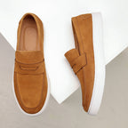 Men's textured penny loafers with rounded toes and white flat soles
