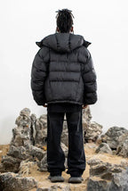 Black hooded cropped puffer jacket with zip front and snap pockets