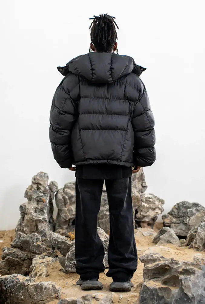 Black hooded cropped puffer jacket with zip front and snap pockets