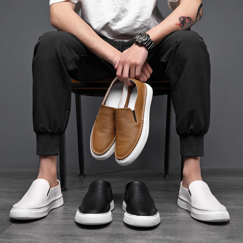Textured slip-on loafers with rounded toes and flat contrasting soles