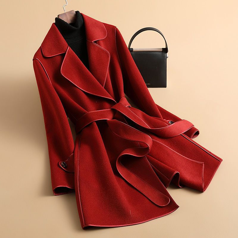 Women's longline belted trench coat with wide lapels and contrast edging