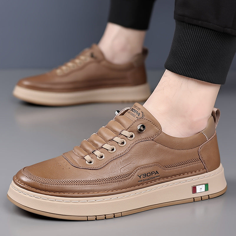 Low-top lace-up trainer with panelled upper, round toe and flat textured sole