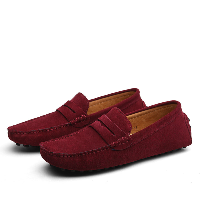 Men's slip-on penny loafers with moc toe stitching and flat treaded soles