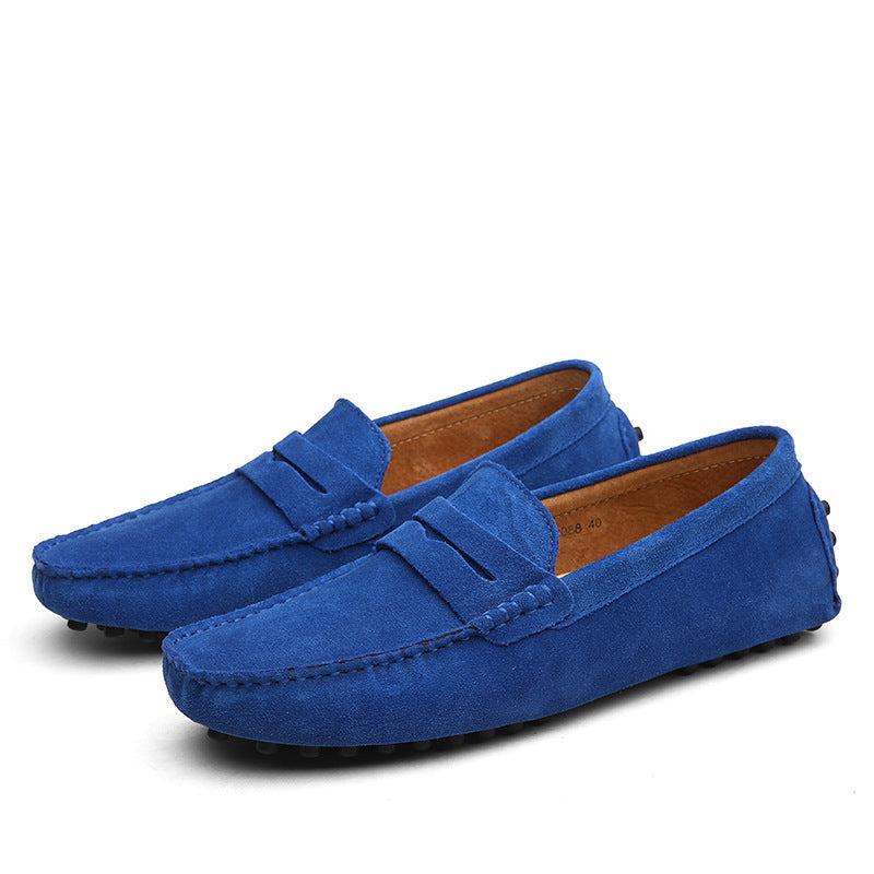 Men's slip-on penny loafers with moc toe stitching and flat treaded soles