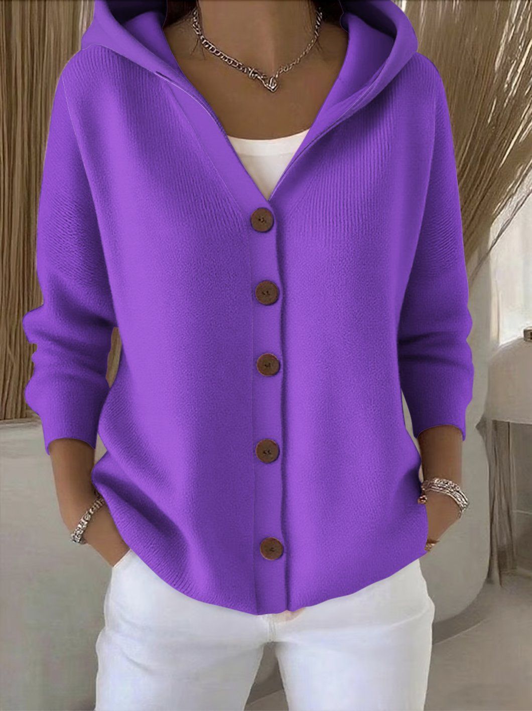 Women's hooded button cardigan shown in multicoloured patchwork and bee motif designs