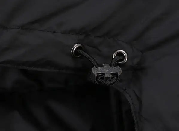 Black hooded cropped puffer jacket with zip front and snap pockets