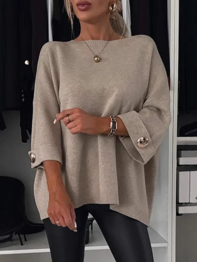 Women's knitted jumper with round neckline, three-quarter sleeves and button cuffs