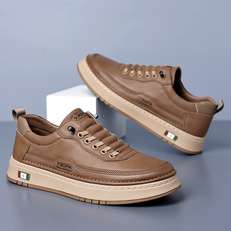 Low-top lace-up trainer with panelled upper, round toe and flat textured sole