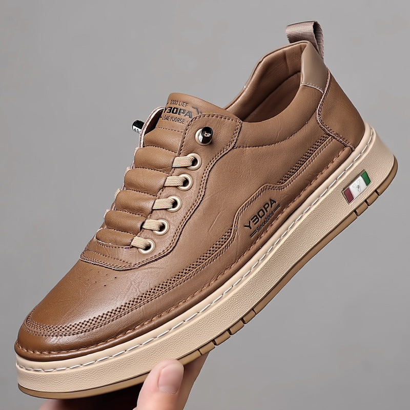 Low-top lace-up trainer with panelled upper, round toe and flat textured sole