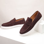 Men's textured penny loafers with rounded toes and white flat soles