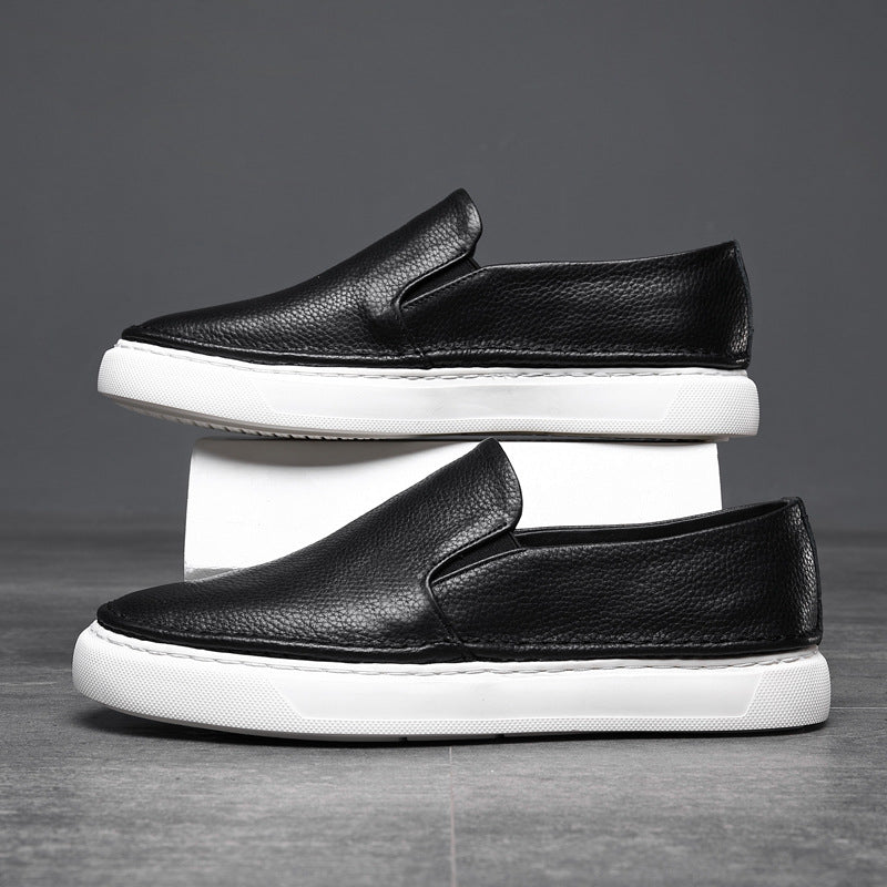 Textured slip-on loafers with rounded toes and flat contrasting soles