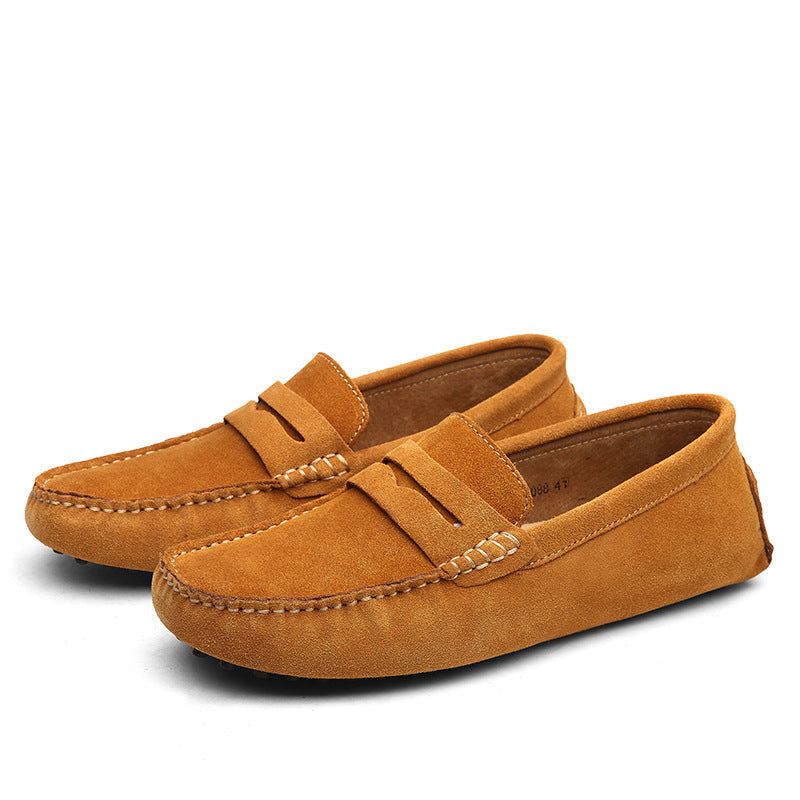 Men's slip-on penny loafers with moc toe stitching and flat treaded soles