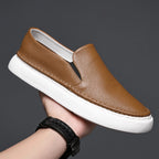 Textured slip-on loafers with rounded toes and flat contrasting soles