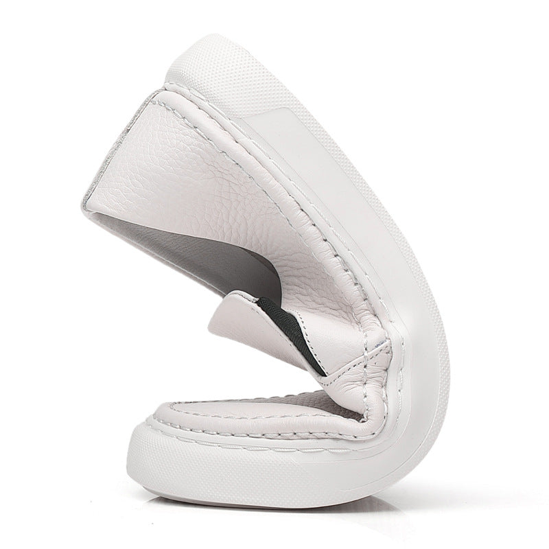 Textured slip-on loafers with rounded toes and flat contrasting soles