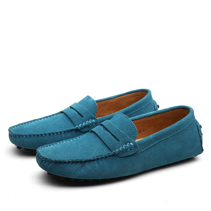 Men's slip-on penny loafers with moc toe stitching and flat treaded soles