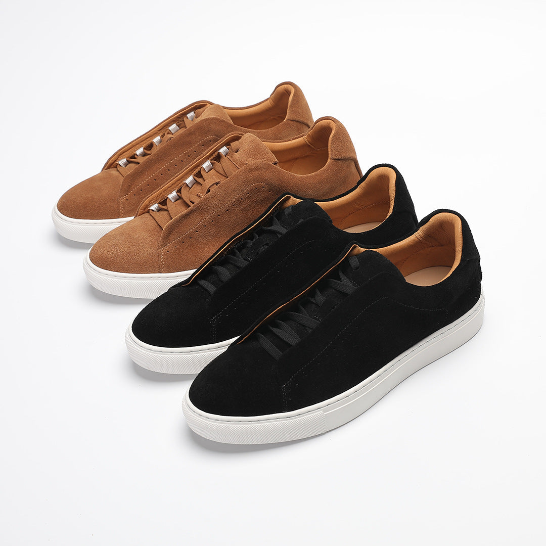 Low-top lace-up trainer with perforated side detailing and contrasting white sole