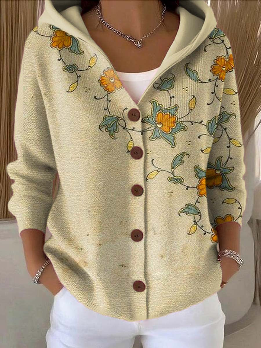 Women's hooded button cardigan shown in multicoloured patchwork and bee motif designs