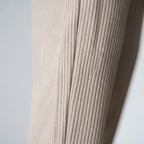Men's textured pleated trousers with an elasticated waistband and straight legs