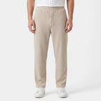 Men's textured pleated trousers with an elasticated waistband and straight legs