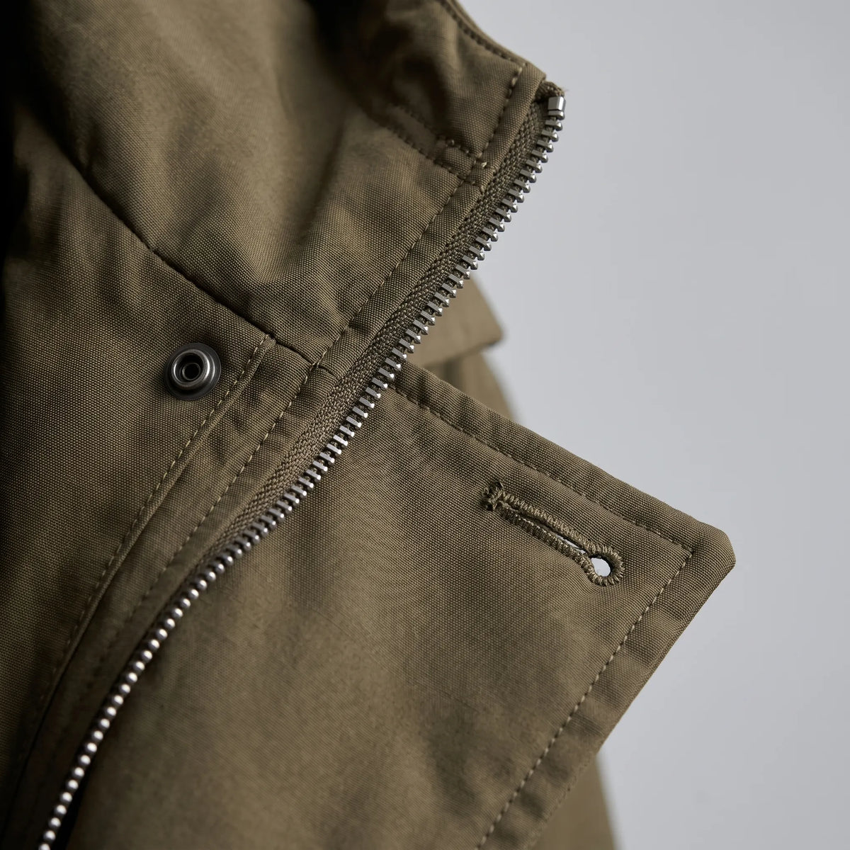 Men's long hooded coat with zip front, button placket and flap pockets